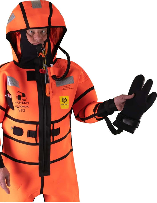 Hansen Protection SeaNordic Wet Suit 82606– A 6-hour immersion suit produced in extra strong flame-retardant neoprene. SeaNordic is equipped with an emergency light and has an integrated sprayhood that protects the face from waves and possibly seabirds. The hood has an innovative inflatable bladder for improved water tightness of the face seals, improved floatation and freeboard. The suit is certified for use without a lifejacket and is perfect as a survival suit on board fishing vessels, merchant ships and