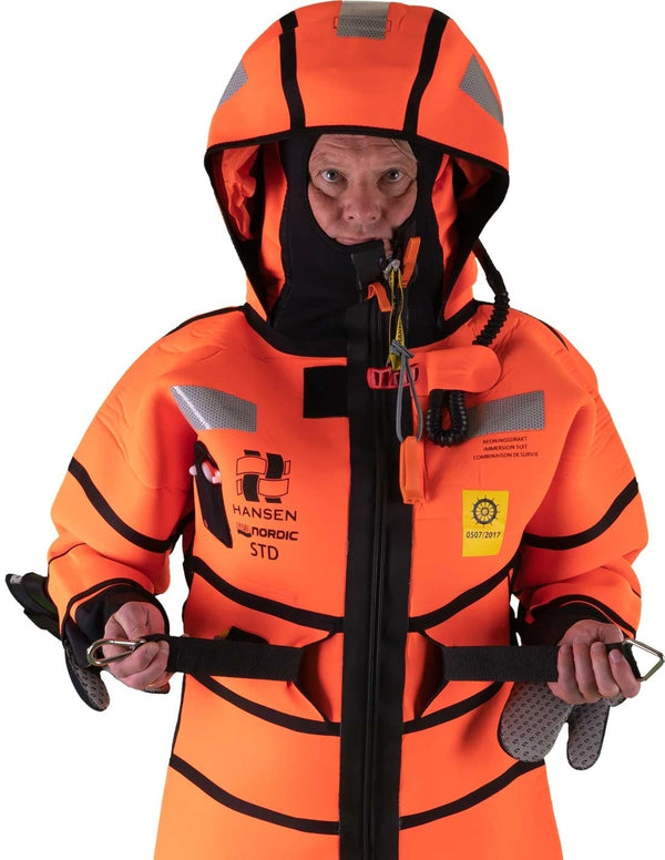 Hansen Protection SeaNordic Wet Suit 82606– A 6-hour immersion suit produced in extra strong flame-retardant neoprene. SeaNordic is equipped with an emergency light and has an integrated sprayhood that protects the face from waves and possibly seabirds. The hood has an innovative inflatable bladder for improved water tightness of the face seals, improved floatation and freeboard. The suit is certified for use without a lifejacket and is perfect as a survival suit on board fishing vessels, merchant ships and