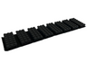 Black plastic mat with multiple grooves on a white background